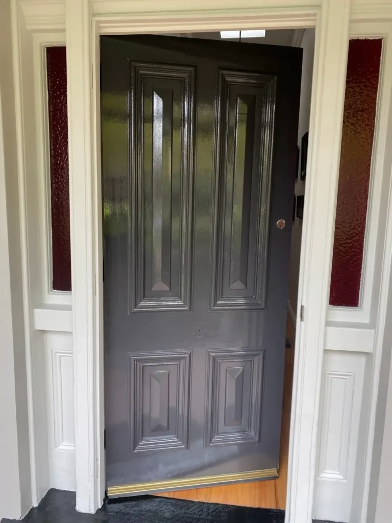 Professional high-gloss front door painting service in Melbourne CBD by EQ Painting Solutions.
