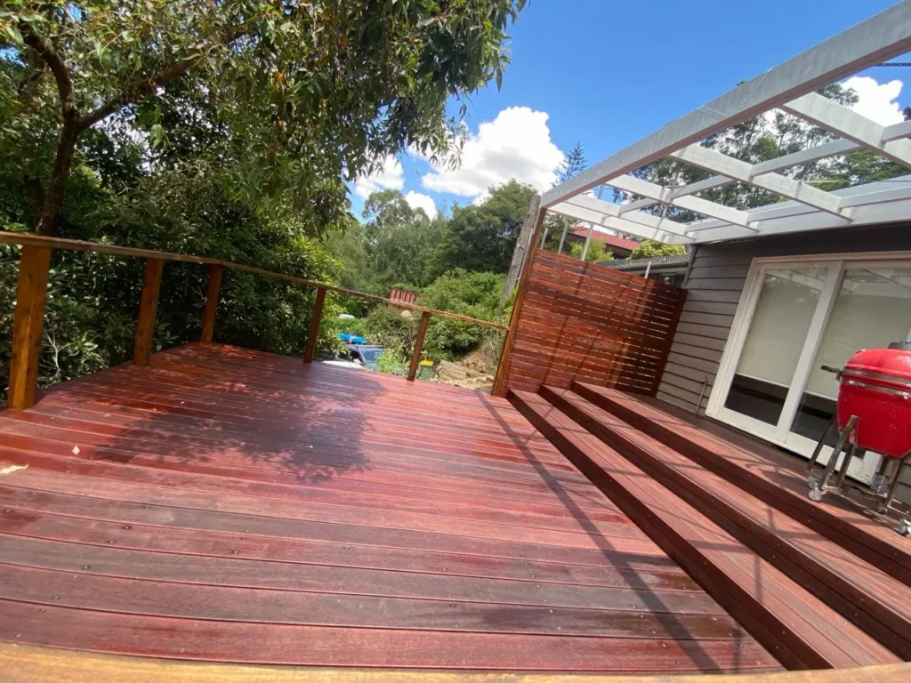 A freshly stained and painted outdoor timber deck with premium weather-resistant coating in Melbourne CBD by EQ Painting Solutions.